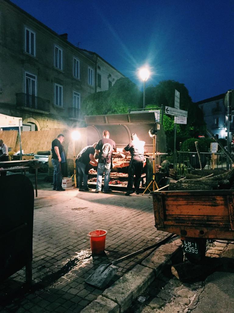 Men around a cow on a spit at nighttime in Jelsi at the festival of San Amanzio