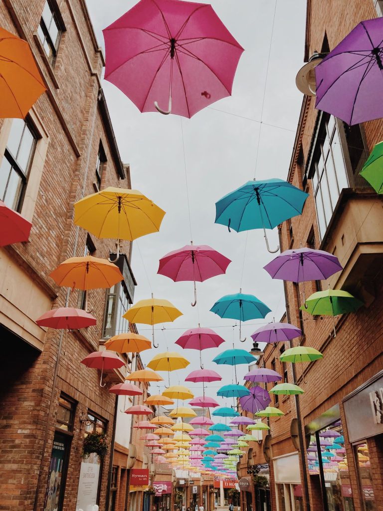 Durham City Centre, colourful umbrellas lining the street. 