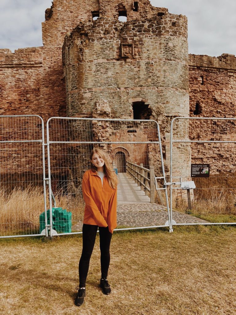 Emily (The Heritage Tourist) in front of Tantallon Castle in North Berwick 