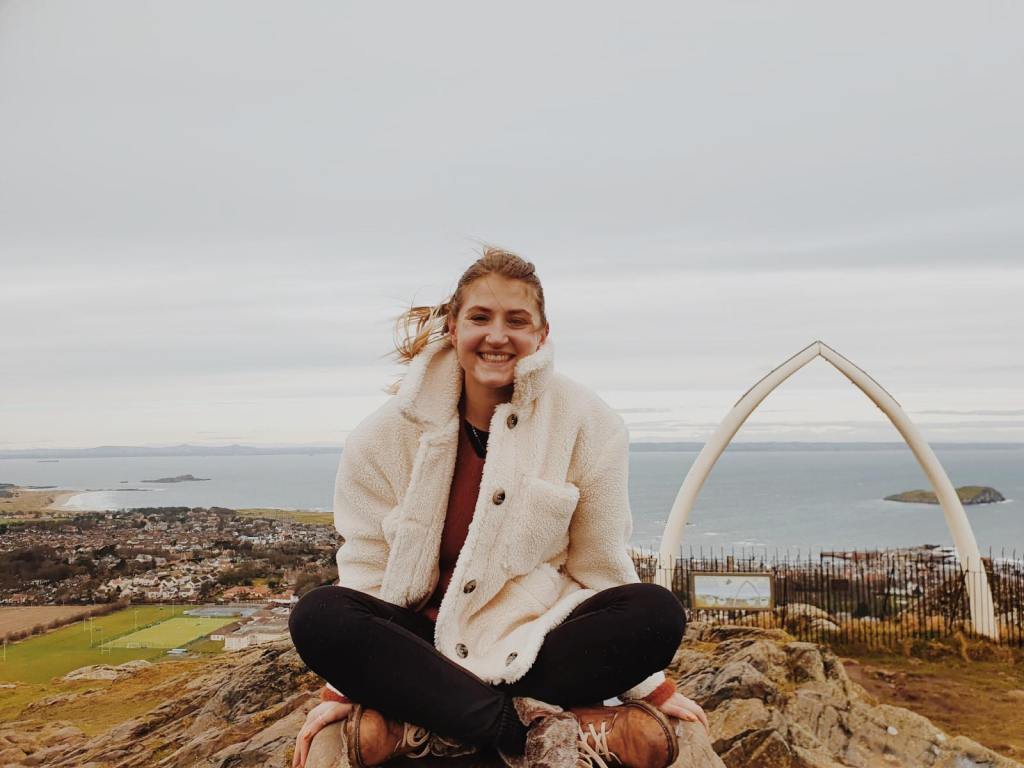 Emily, The Heritage Tourist, up the Law in North Berwick, with whale Jawbone