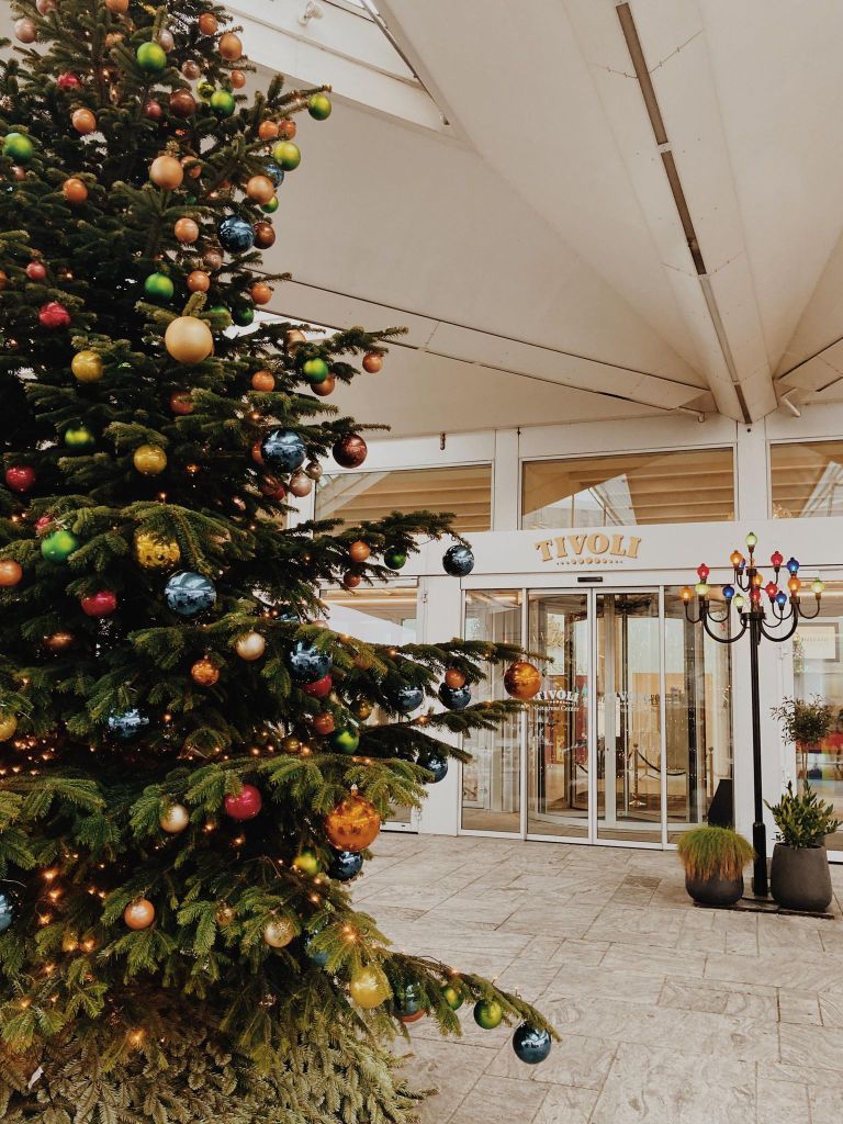 The Tivoli Hotel and Congress Centre entrance, with a Christmas tree across the left side of the photo